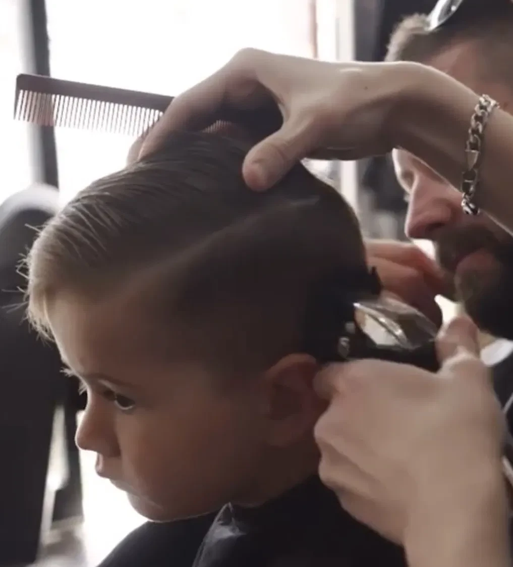 Little boy getting a haircut