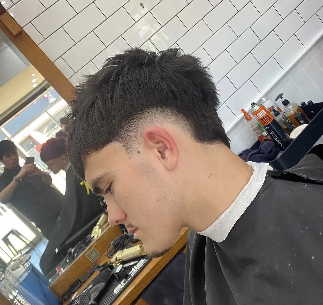 Men's haircut being styled