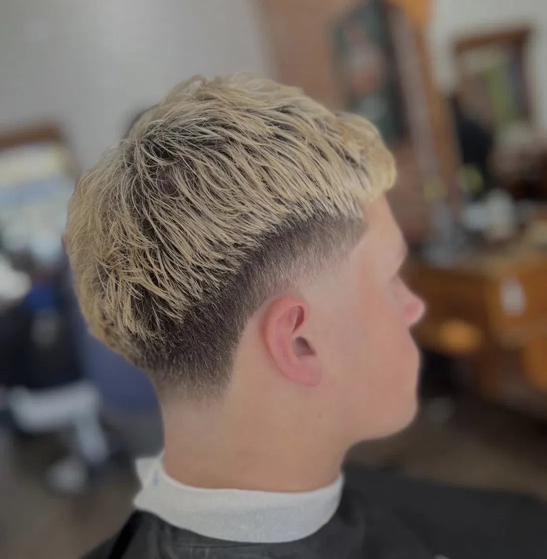 Blond textured cut with taper fade
