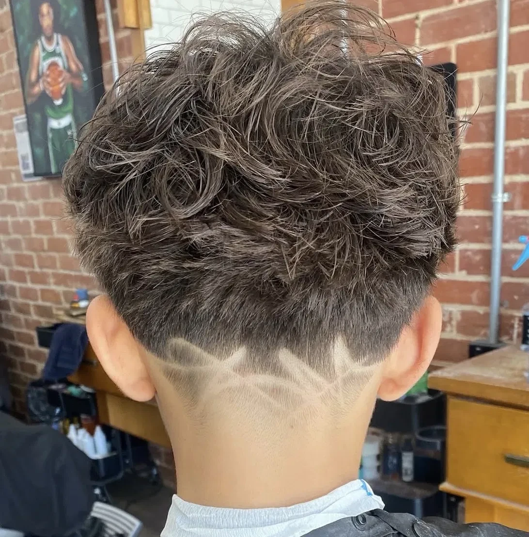 Curly top with freestyle design at the back